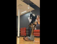 Guy attempts handstand on feet gym fail