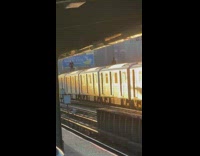 Man stands on the roof of the train while operate 