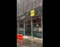 Water pours down from scaffolding like waterfall 