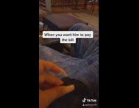 Girl cuts pocket lining with scissors restaurant 