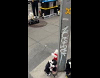 Man plays saxophone dancing toys on street