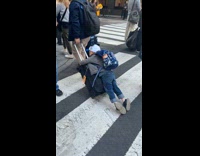 Kid lay on luggage pulled by dad