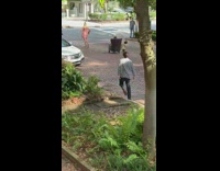 Two girls armchair photoshoot middle of street 