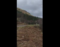 Shirtless guy plays acoustic guitar river outkast 