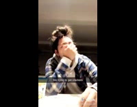 Girl tries to open packaging for crackers 