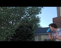 Lady squirts water from gap of teeth