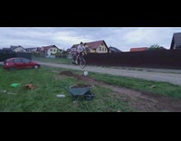 Guy rides bicycle over dirt pile fail 