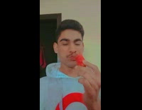 Guy takes bite out of chili pepper