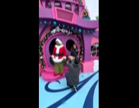 Couple engaged in front of The Grinch