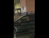 Guy in black car sings opera