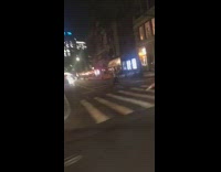 Guy pink suit lay on pedestrian lines