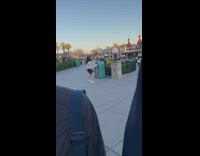 Woman in white sweater tiktok dance at the park