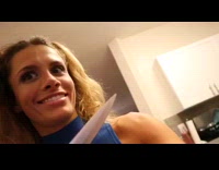 Little girl helps woman bake a cake in the kitchen, licks spoon and gives flower instead of flour