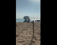 Girl knitted bikini kneel beach pole chain