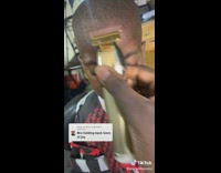 Barber show kid his haircut with mirror