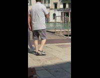 Woman black outfit poses on the log at the dock