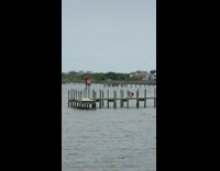 Two people balance log pylons photo shoot