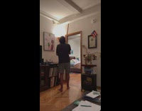 Guy smoosh spider on wall with long stick