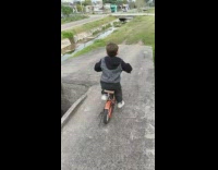 Little boy falls off bicycle dad laughs 