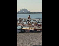 woman black dress small pier hand movements