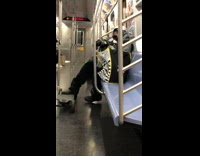 Person on subway is wearing brown goggles 