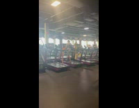 Lady knits a scarf while on the treadmill 