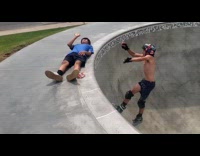Shirtless guy roller blades jump over friend