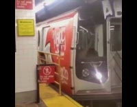 Collab Subway Creatures - Subway train arrives into station tagged with red gray graffiti 