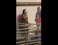 Guy does arm workout in white mask 