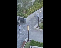 Guy merch photo walk outside light pole