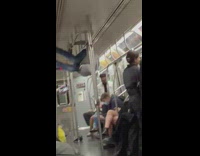 Guy dance at the pole inside the train while travel 