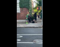 Collab winy - Man green hat and buff clown talk on street