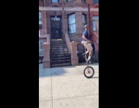 Collab WINY - Man rides unicycle on the street