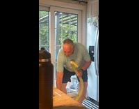 Dad holds long cucumber and says Ricola