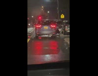 Guy records person in car in front of him peeing in the street