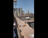 Girl burger on bridge railing white top 