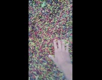 Guy picks up handful of small berries