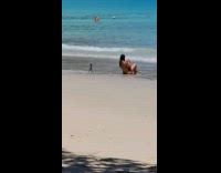 Collab IITW - Woman in bikini poses with a coconut drink on the beach