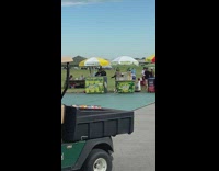 Three women tiktok dance behind the lemonade stand