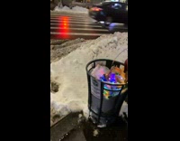 Flashing christmas lights left in trash can 