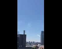 Collab WINY - two girls hug on roof watching jets pass