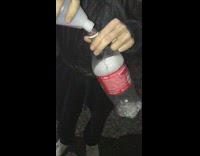Guy pours liquid into coke bottle and it explodes