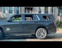 Car parked at street with broken windows