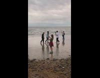 Two men rap video shoot with fire dancers behind them