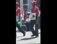 Collab WINY - Man sit beside pole and feed pigeons