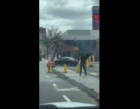 Woman imitate inflatable tube man on street