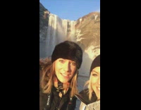 people pose frozen waterfall rainbow