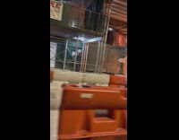 Piles of Garbage Bags Burn on Street