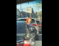 Collab winy - Chucky doll hanging outside car window traffic