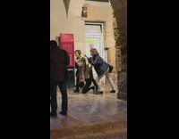 Women do cute pose together on sidewalk